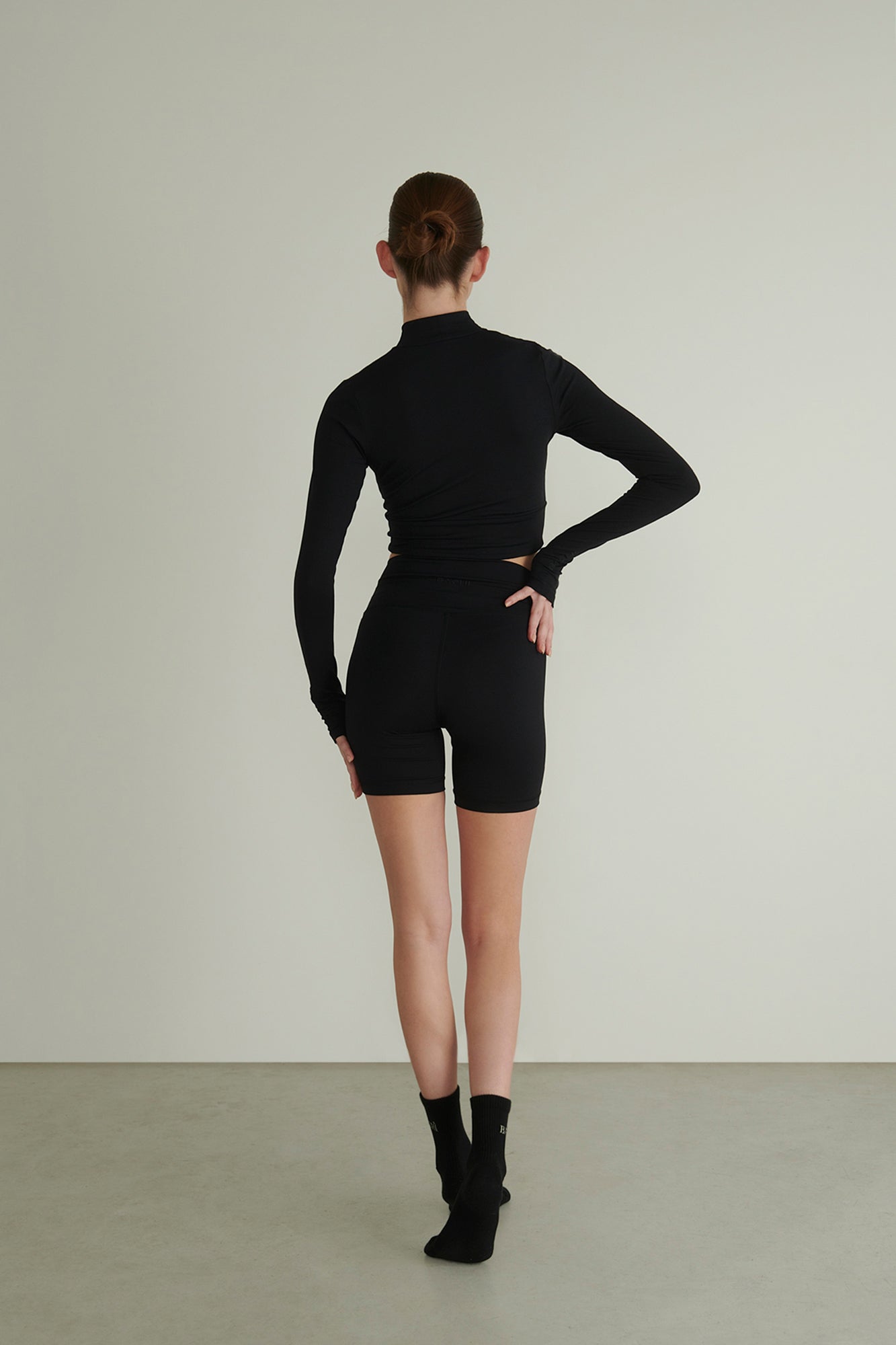 Black Outfit by BACHÌ from the Back
